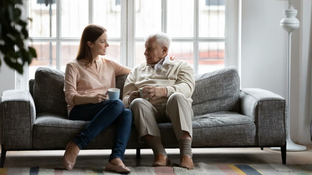 Paradigm Senior Living | Senior man and his daughter talking