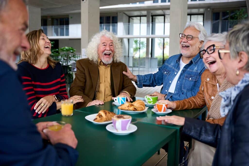 Paradigm Senior Living | Senior Friends Laughing At Breakfast